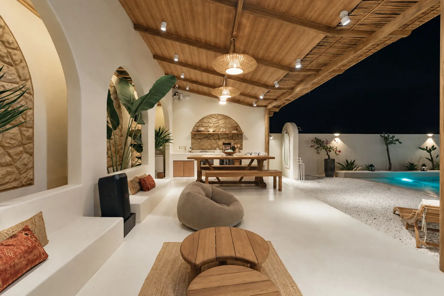 Casa Tanaw covered pavilion and courtyard illuminated in the evening