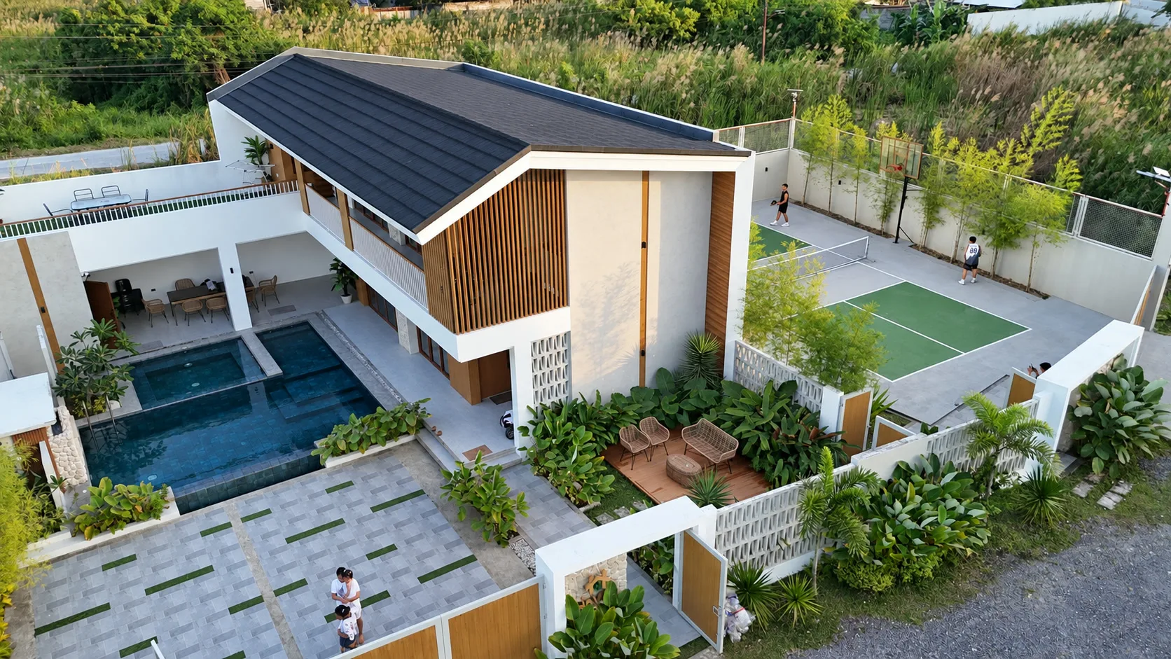 Aerial view of Haven Villa showing the house, pool, entrance court, planting, deck, and recreation court
