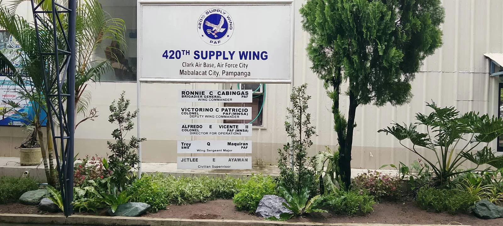 Completed planting around the 420th Supply Wing sign